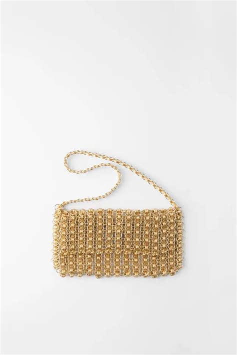 bolso dorado zara.